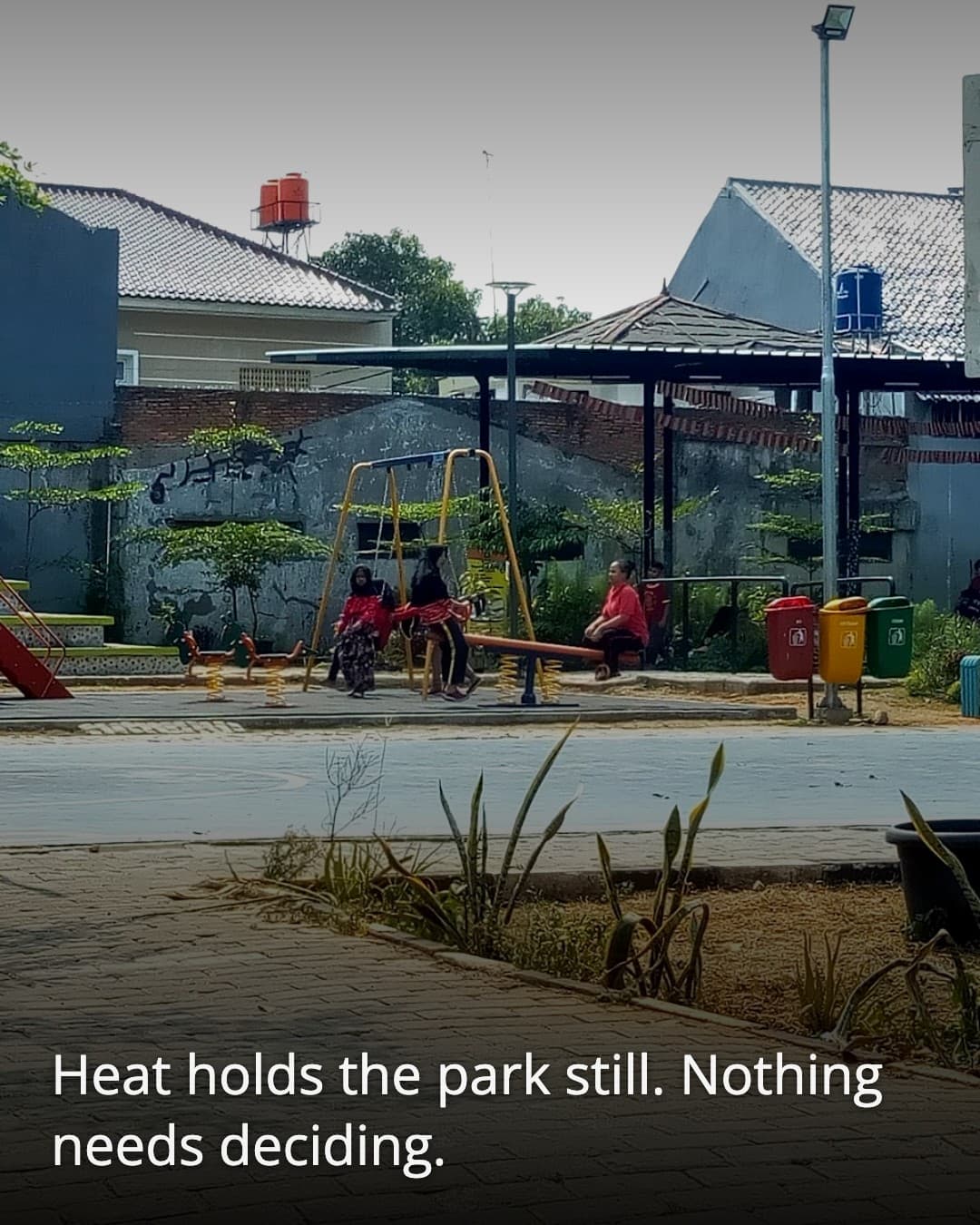 RPTRA Tiga Durian empty swing in sunlight